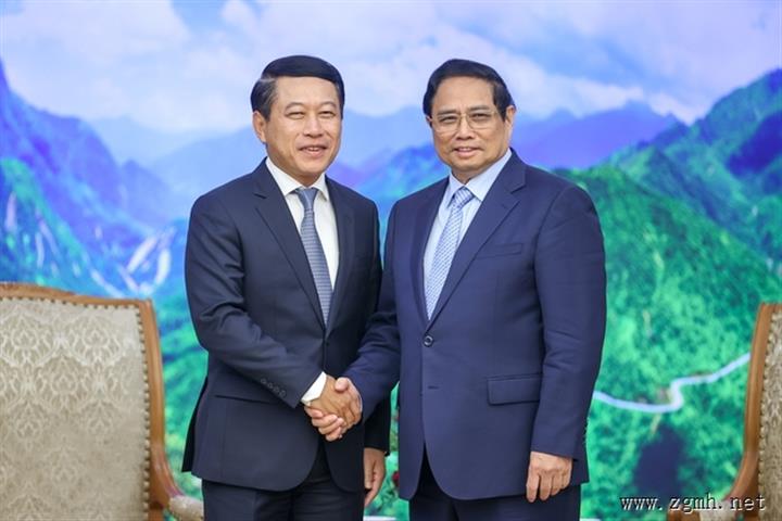 越南政府总理范明正会见老挝政府副总理兼外交部长沙伦塞贡马西