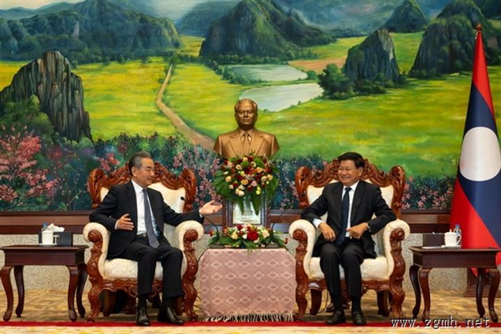老挝人民革命党中央总书记、国家主席通伦会见王毅